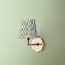 single insignia wall fixture in antiqued brass