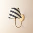 Gramma wall fixture in antiqued brass