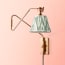 Cooper Wall fixture in antiqued Brass