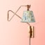 Cooper Wall fixture in antiqued Brass
