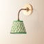 Colombari wall fixture in antiqued brass and cane