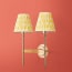 Double Tremmers wall fixture in antiqued brass