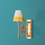 Tina wall fixture in antique brass