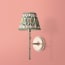 Larger Single chukka wall fixture in antiqued brass