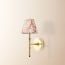 Single Chukka cordless wall fixture in antique brass