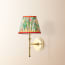 Single Chukka cordless wall fixture in antique brass