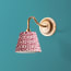Swan neck wall fixture in antiqued brass