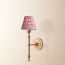 Wrappling wall fixture in antiqued brass