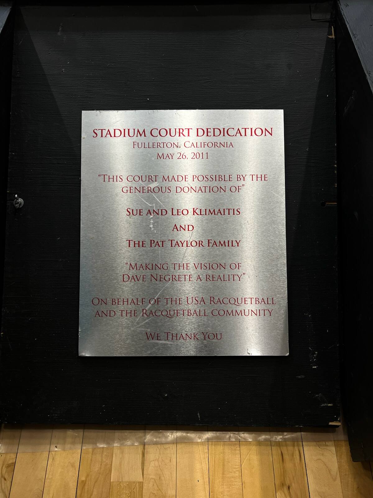 Plaque dedicating the stadium court to Leo and Sue Klimaitis