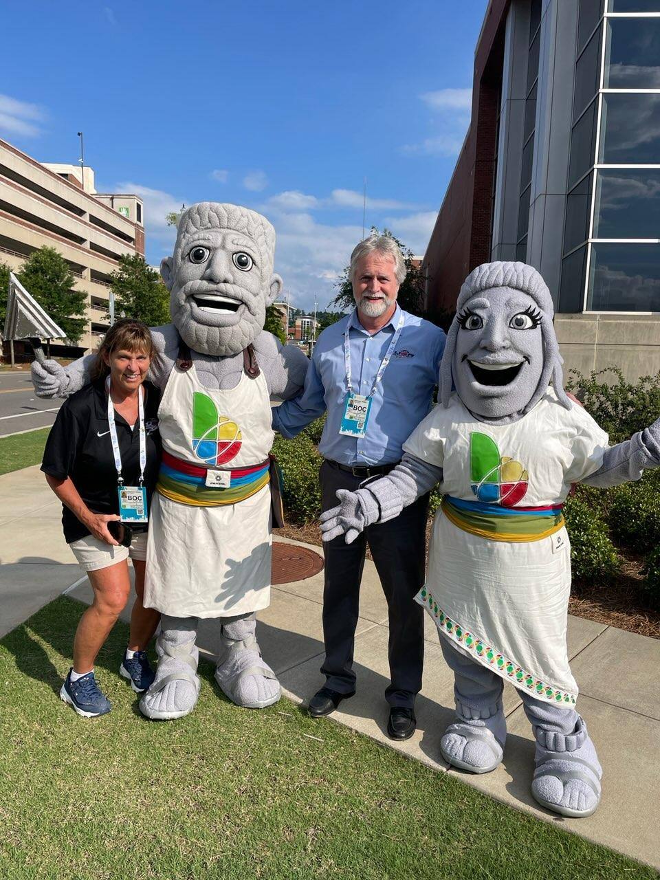 Mike and Deb Wedel with Vulcan and Vesta, the World Games Mascots