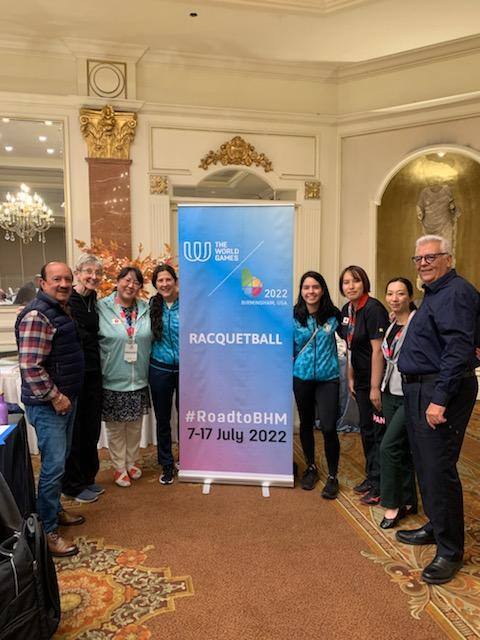 Group in front of standup from World Delegation Meeting