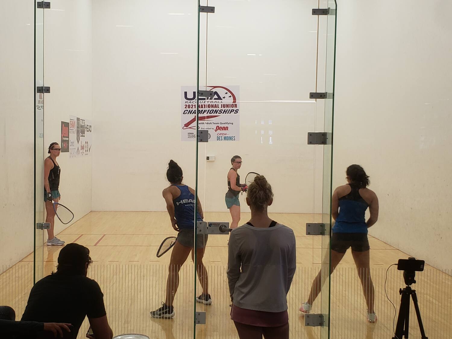 Sheryl Lotts serves Kelani Lawrence and Hollie Scott while Michelle De La Rosa stands against the wall.