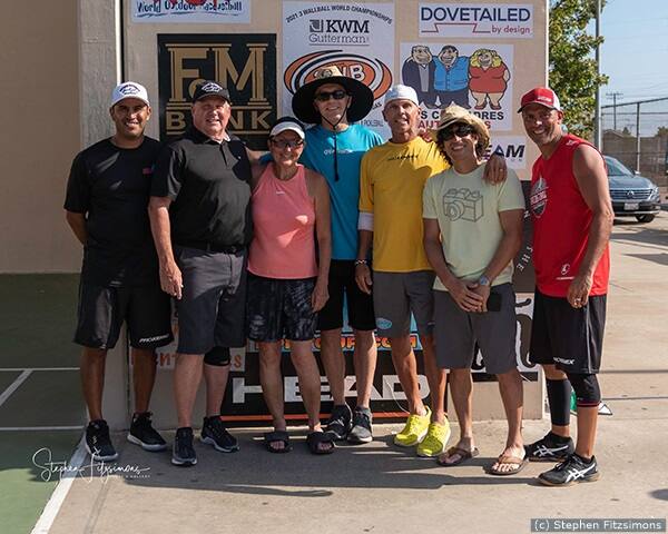 Racquetball players standing outside.