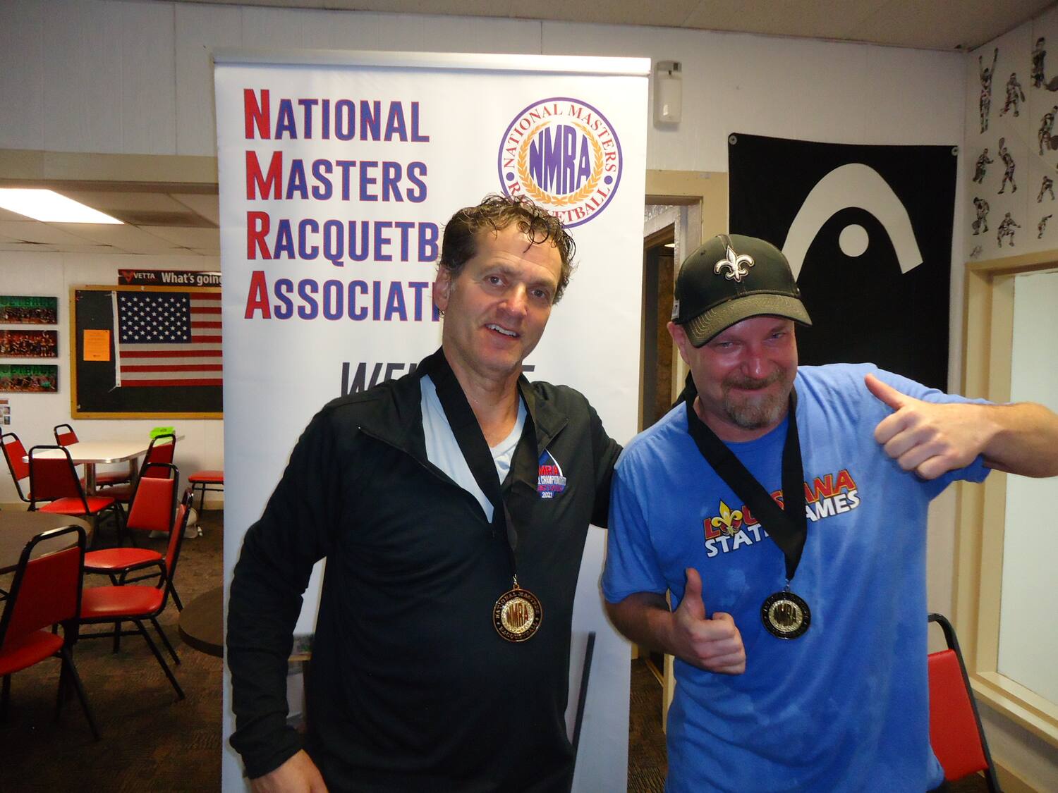 NMRA 2021 St. Louis MD50 Cohen Satawa standing in front of a banner.