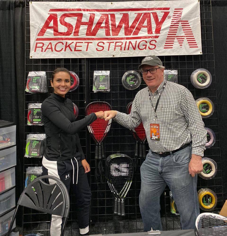 Maria Jose Vargas & Steve Crandall in front of Ashaway banner