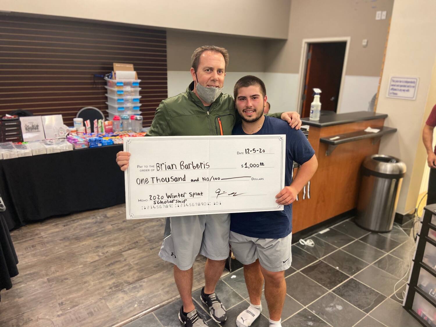 Kevin Sendrey present check to Brian Barberis
