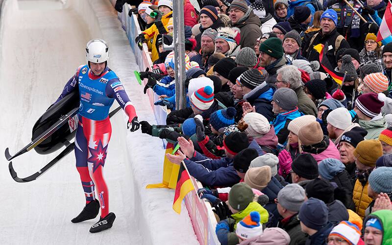 Tucker West of the United States celebrates during the team relay race at the Luge World Championships in Oberhof, Germany, Sunday, Jan. 29, 2023. (AP Photo/Matthias Schrader)