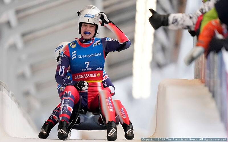 Chevonne Forgan and Sophia Kirkby of the United States celebrate during the women's doubles race at the Luge World Championships in Oberhof, Germany, Saturday, Jan. 28, 2023. (AP Photo/Matthias Schrader)
