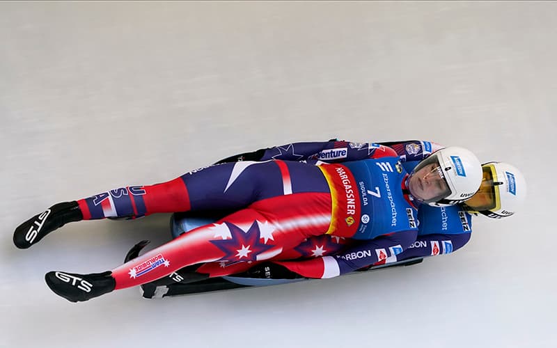 Chevonne Chelsea Forgan and Sophia Kirkby of United States speed down the track during their women's doubles race first run of the Luge World Cup in Sigulda, Latvia, Saturday, Jan. 14, 2023. (AP Photo/Roman Koksarov)