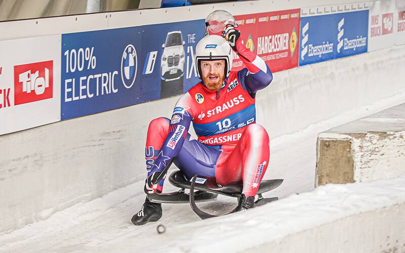 Jonny Gustafson take 6th place and celebrates in the Igls, Austria outrunon December 4 2022
