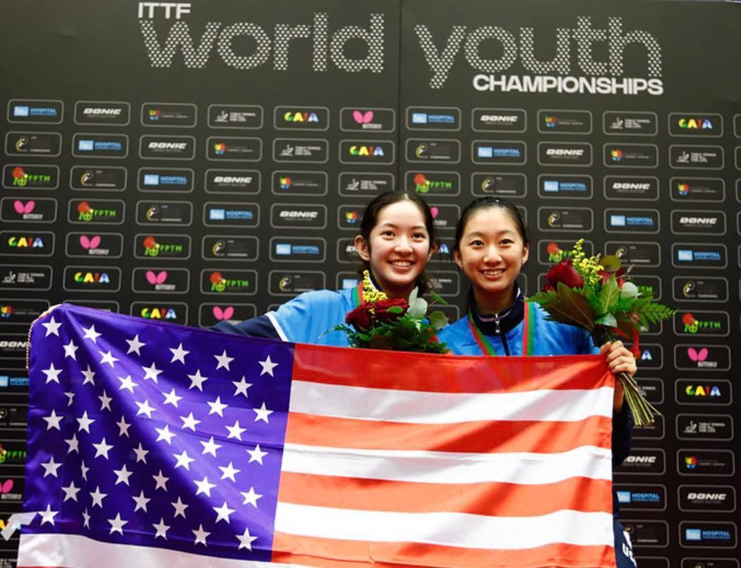Rachel Sung and Amy Wang Holding American Flag at ITTF World Youth Championships