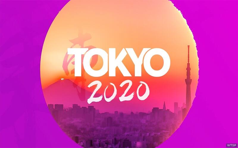 Tokyo 2020 text inside a sun shaped window viewing Tokyo.