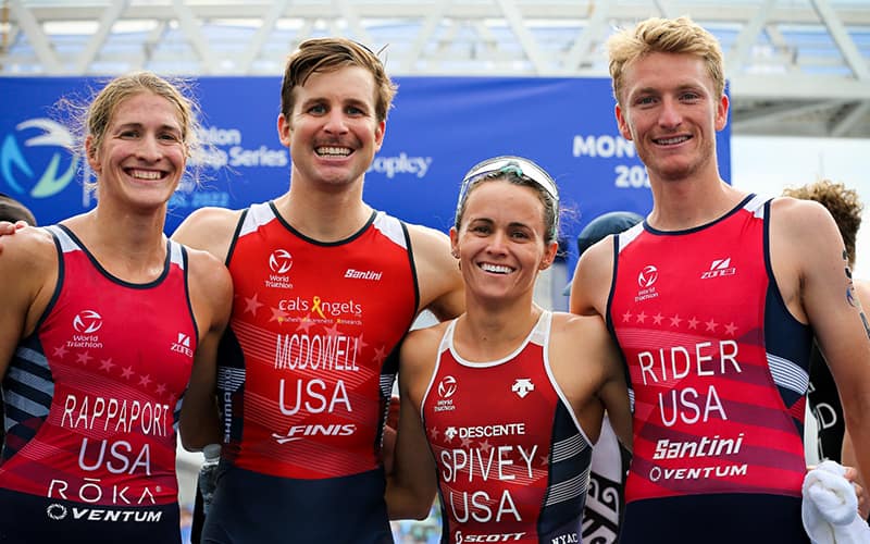 photo of four u.s. athletes posing together with smiles on their faces. from left to right: Summer Rappaport, Kevin McDowell, Taylor Spivey and Seth Rider