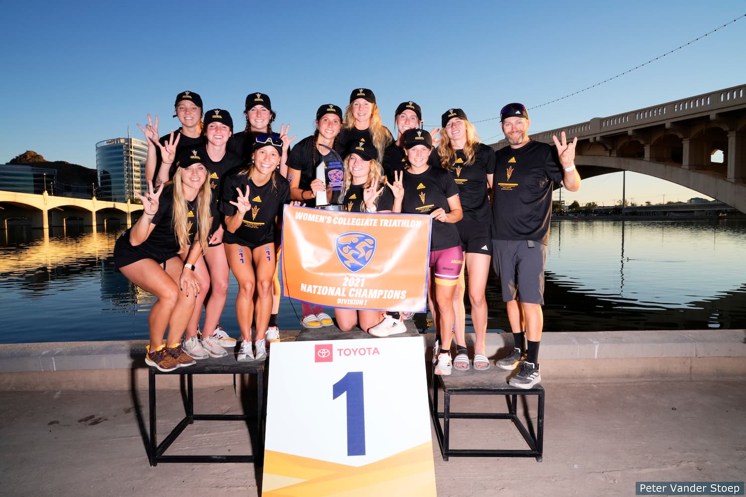 arizona state university athletes stand on the podium together