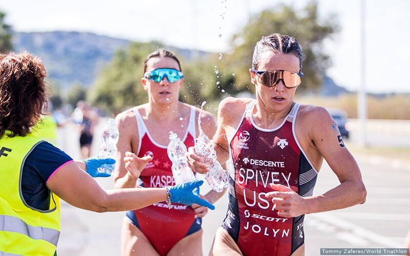 taylor spivey and kirsten kasper run during a triathlon
