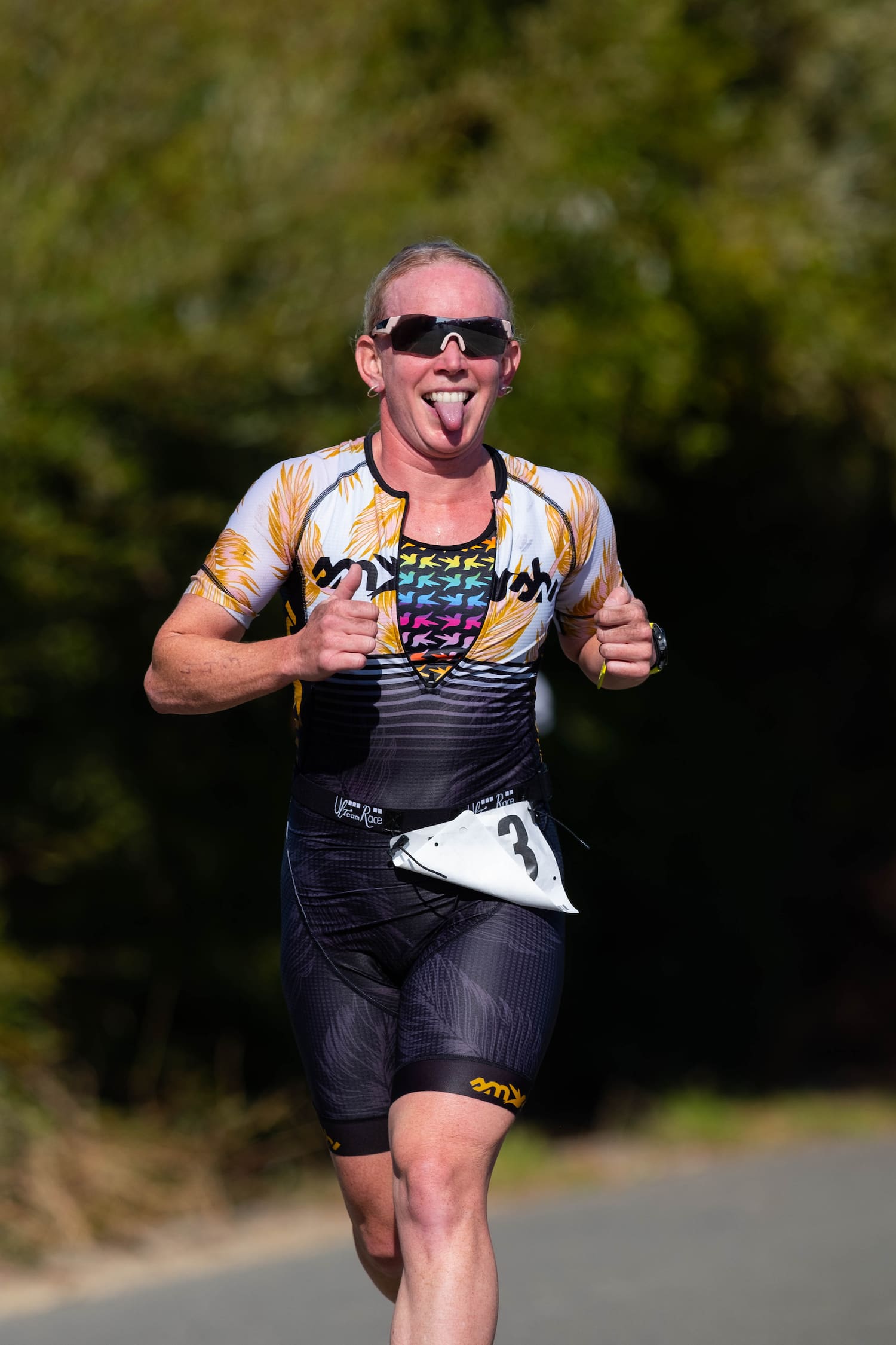 Triathlete Kelly O'Mara runs during a triathlon