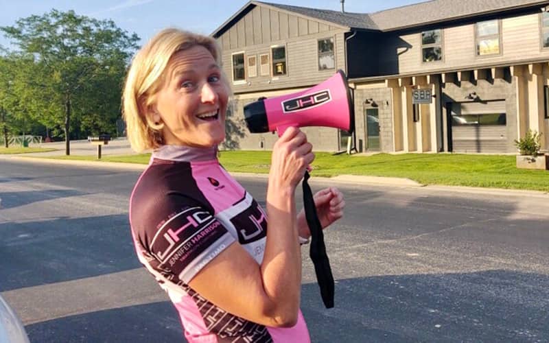 Jennifer Harrison yells through a megaphone.