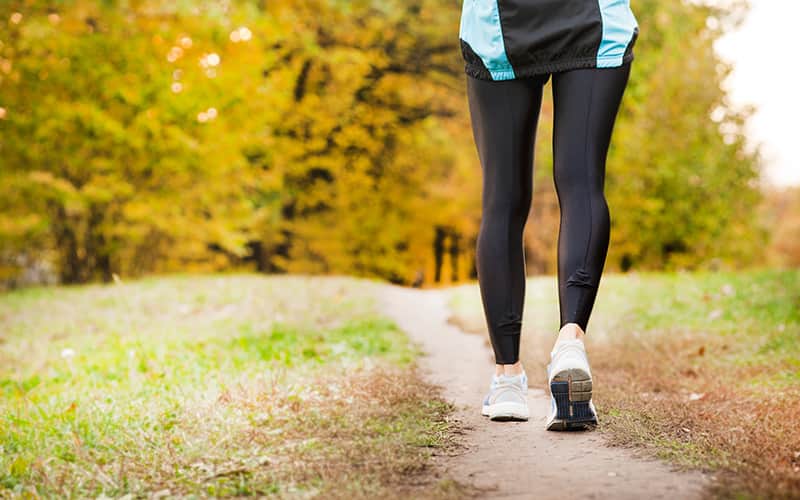 woman walking on the trail