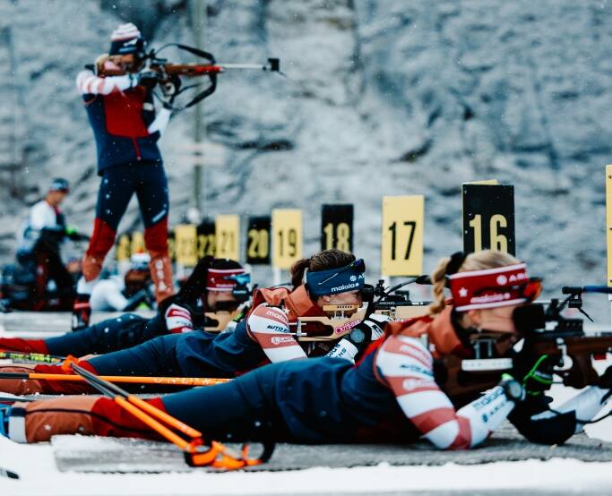 Biathletes on the shooting range
