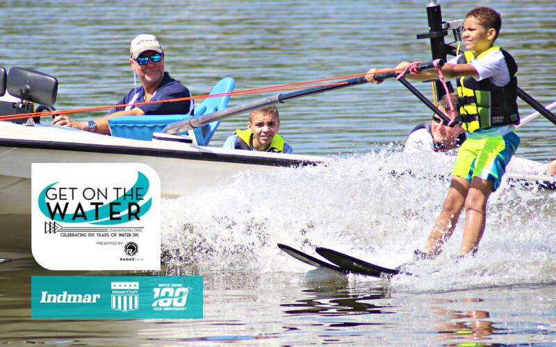 Young athlete water skiing at learn to ski clinic