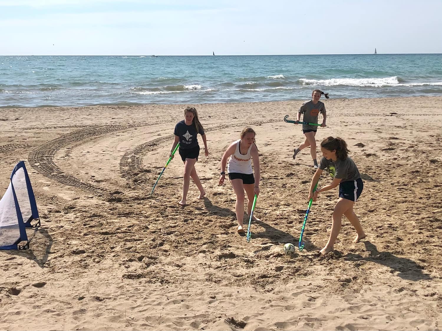 LIFT Field Hockey playing beach hockey