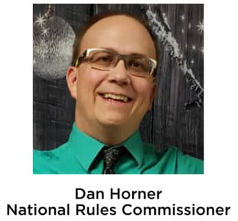 Headshot of Dan Horner in green shirt.