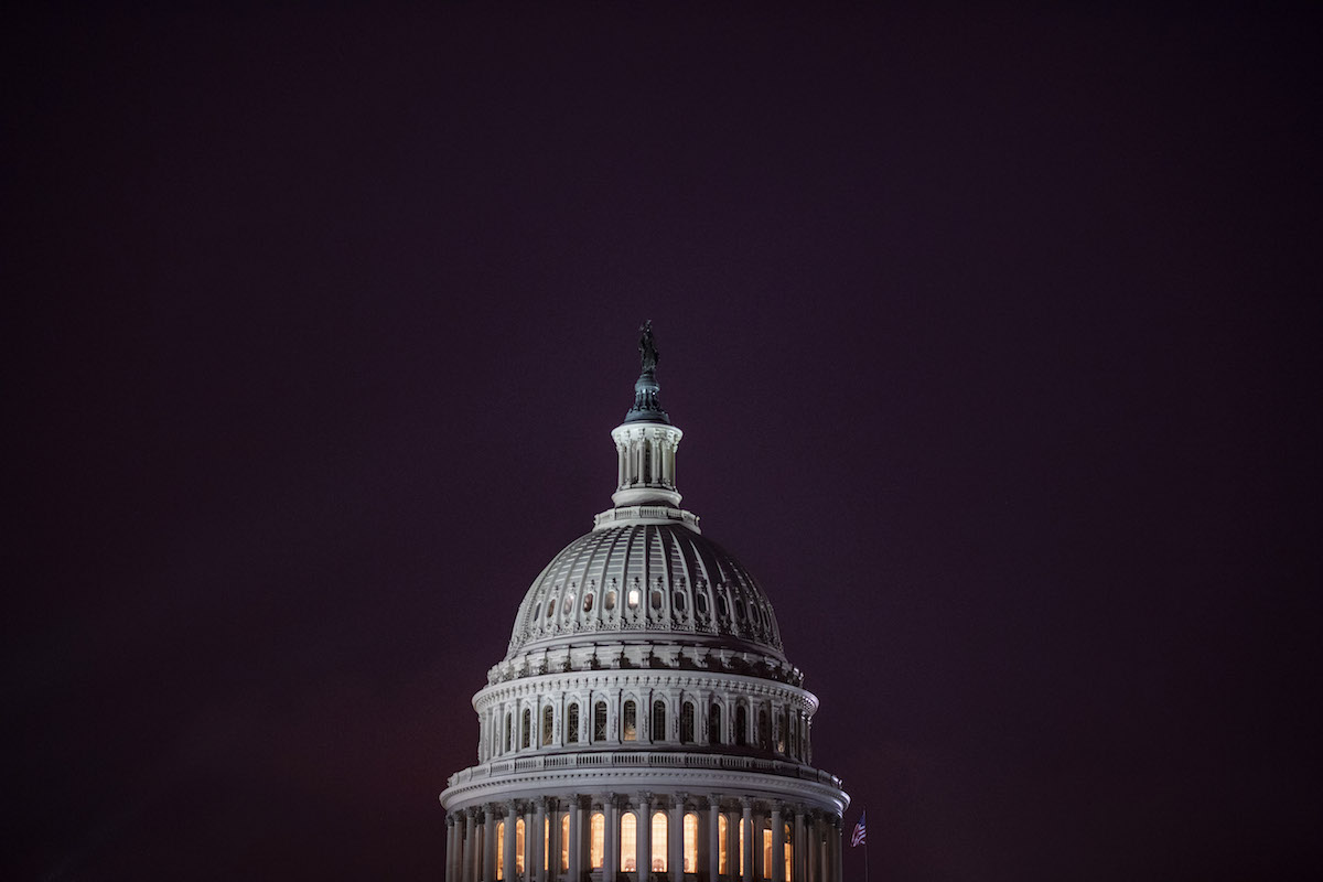 The sun sets on the U.S. Capitol on Jan. 12. (Jabin Botsford/The Washington Post)