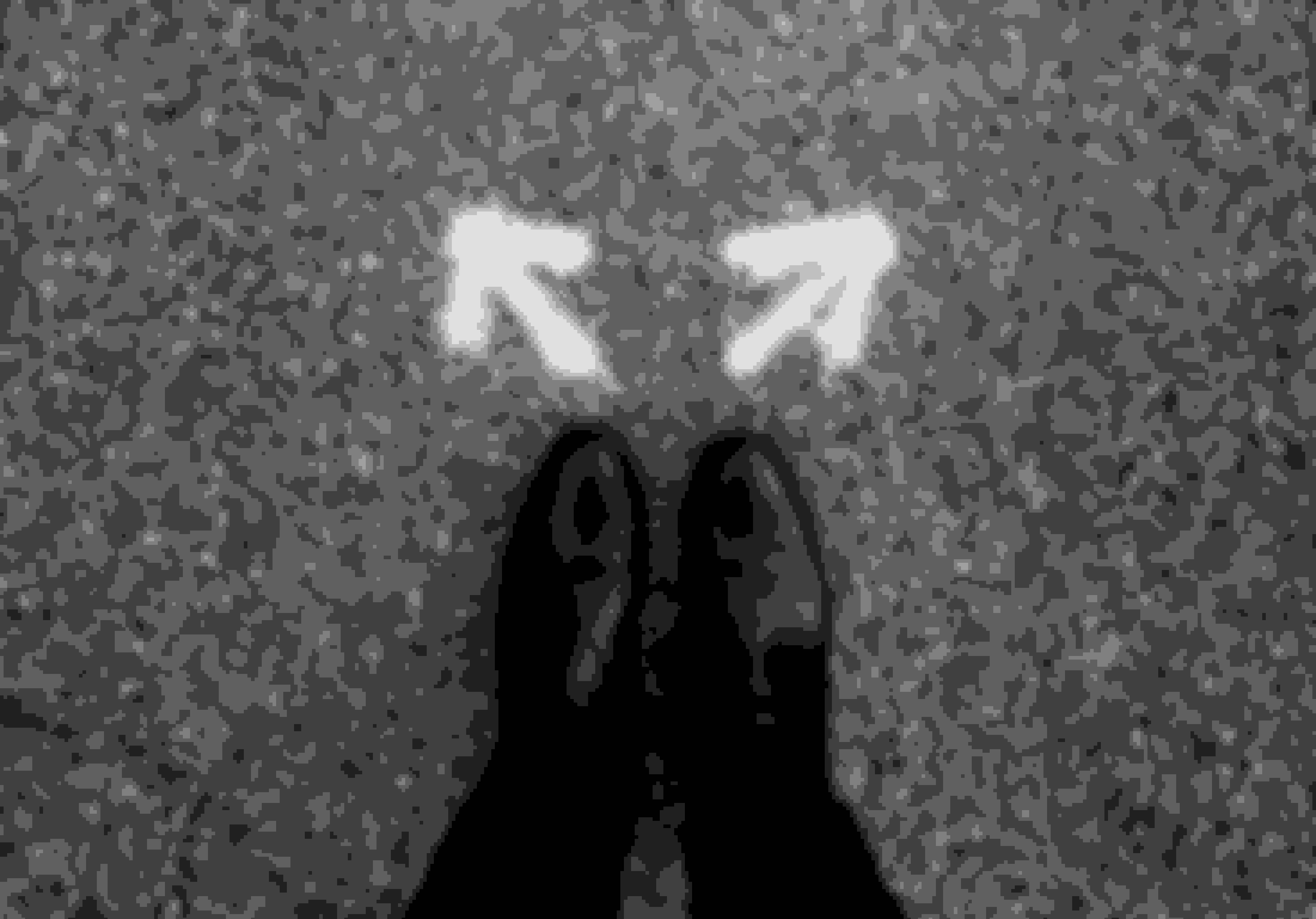 Feet Standing In Front Of 2 Arrows Pointing To 2 Different Direction