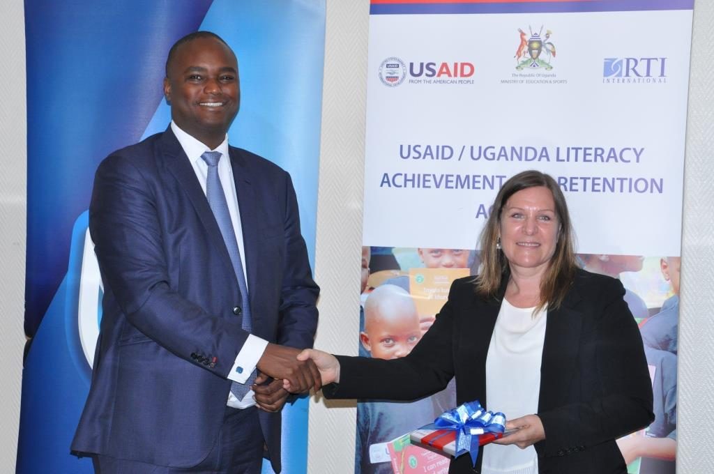 Stanbic hands over Ushs 20 million worth of reading cards to USAID