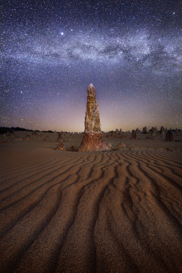 The Pinnacles in Western Australia is perfectly suited to astrophotography. Here the Milky Way core rests above a lone limestone figure emerging from the earth. Canon EOS 5D MK II, 16-35mm f/2.8 lens @ 16mm. Two exposures merged: Sky – 20s @ f2.8, ISO 3200; Foreground – 1/15s @ f8, ISO 100.