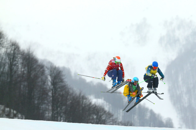 Sami Kennedy-Sim of Australia leads from Georgia Simmerling (L) of Canada and Anna Woerner (C) of Germany in the Freestyle Skiing Womens' Ski Cross 1/8 Finals on day 14 of the 2014 Winter Olympics at Rosa Khutor Extreme Park on 21 February, 2014 in Sochi, Russia. Photo by Cameron Spencer/Getty Images.