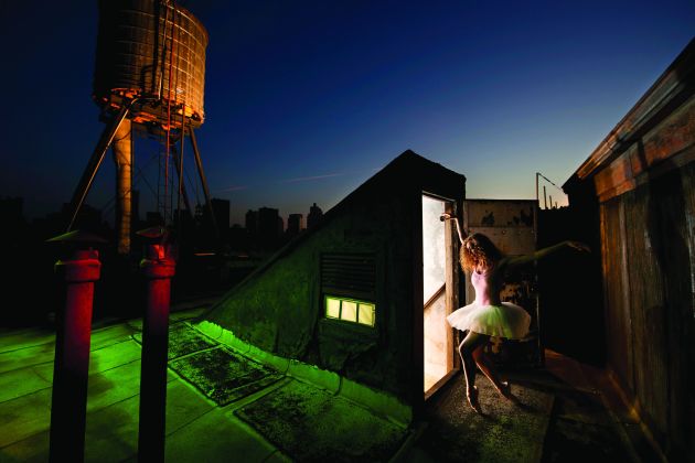 © Joe McNally. Jay Maisel’s rooftop in NYC. Total of 13 flashes all commanded by a one commander flash. Shot for an advanced techniques lighting video.