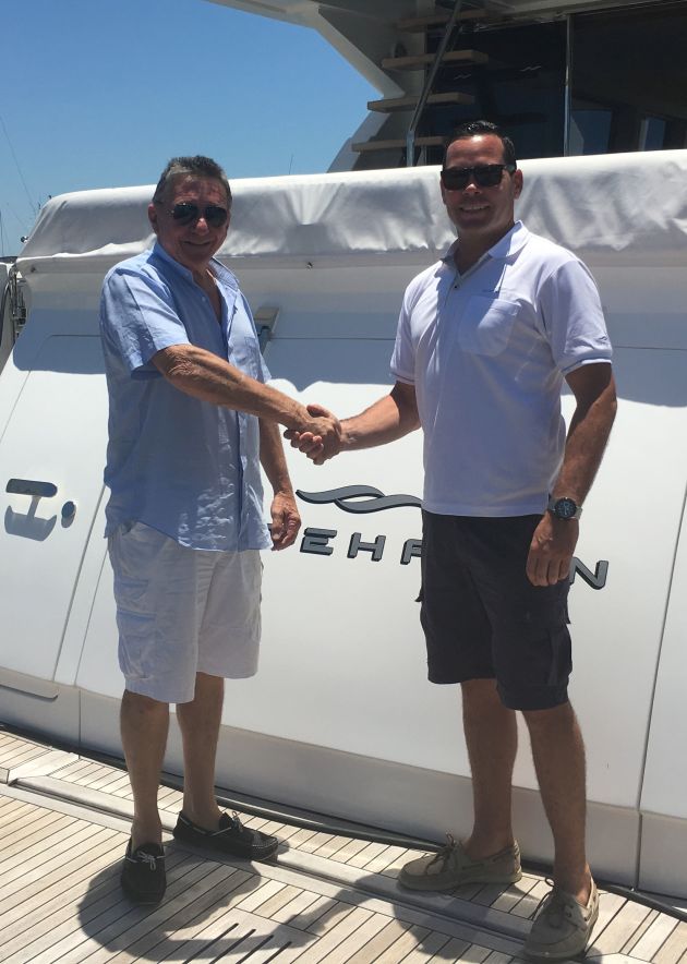Keith Hanson (left) welcomes Andy Taylor of AMT Marine to the Whitehaven Motor Yacht dealership network.