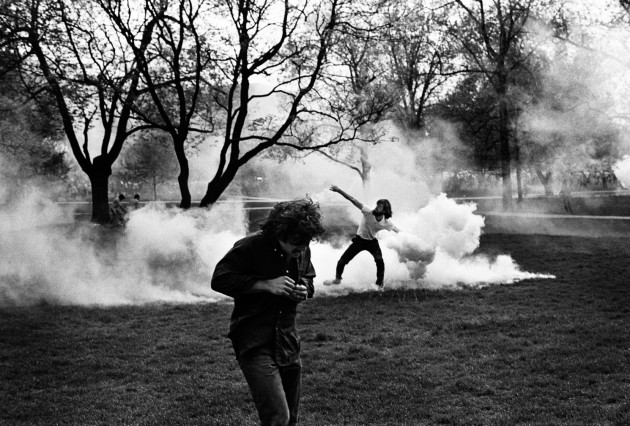 Throwing back tear gas, Cambodian invasion riot, Columbus, Ohio. © Ken Light.