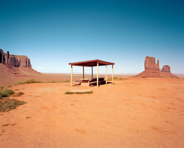 Monument Valley, Arizona – This is one of the last picnic tables in Monument Valley. There were many more, but the rest were demolished so that a hotel overlooking the valley could be built. This table is located in a pull-off, offering a great view of “The Mittens” rock formations in the background.
© Ryann Ford, from The Last Stop: Vanishing Rest Stops of the American Roadside, published by powerHouse Books.