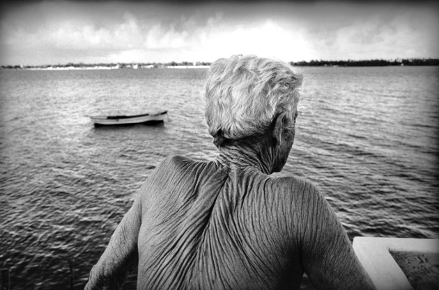 Ze Peixe looks out at the Sergipe River just outside his
home in Aracuju. He has never used moisturiser or any sort of sun protection on his skin. Jose Martins Ribeiro
Nunes, age 74, also known as Ze Peixe or “the
fish”, is Brazil’s most famous boat pilot. He guides ships
into and out of the port in a unique way: by swimming
approximately 10-12 km. © Ed Kashi/VII Photo