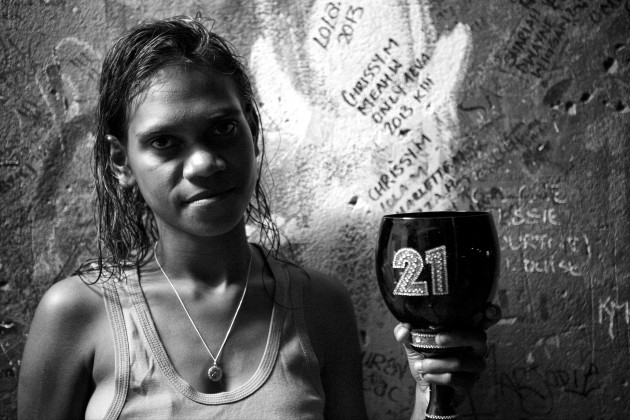 Chrissy holding a birthday cup which has the number 21 on it. Chrissy turned 21 years old, her mum Elaine Wiggan said to me; 