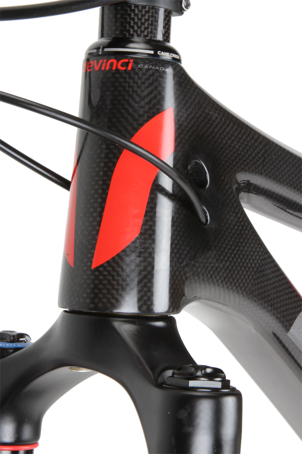 Devinci uses an integrated headset; the bearings fit directly into the moulded head tube—common enough on road bikes but unusual on a carbon MTB.