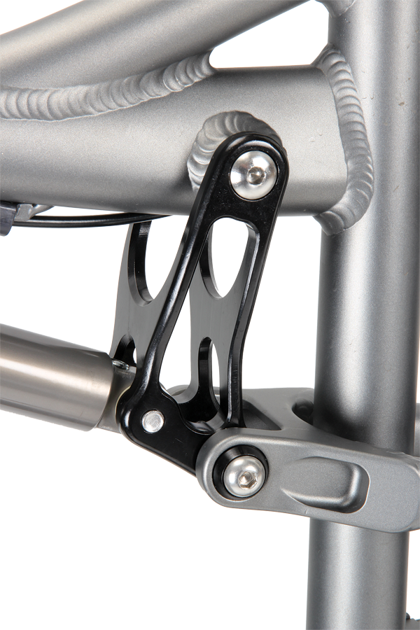 The neatly machined swing-link controls the suspension rate.