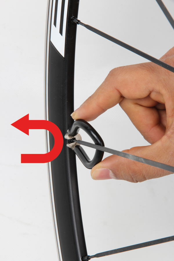 tightening spokes on a bicycle